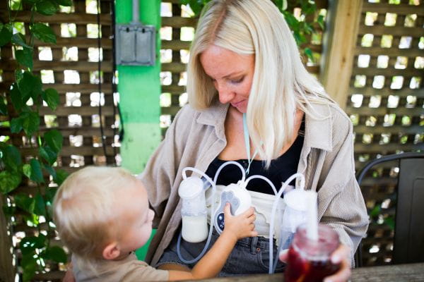 Breastfeeding mom pumping with the Motif Duo