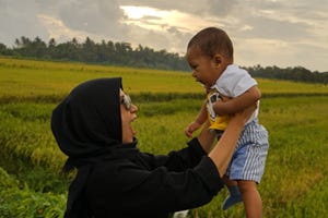 Mother playing with baby