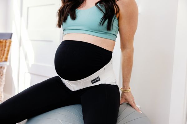 Pregnant Mother Wearing Motif's Pregnancy Back Brace