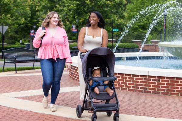 Breastfeeding mom pumping with the motif aura glow outside